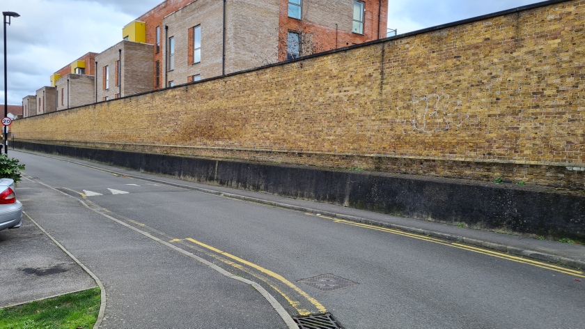 The footprint of the old Addiscombe station has been taken up by a housing estate, but hints to its previous life live on, such as this retaining wall.